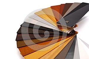 Samples of wooden blinds for windows in a store.