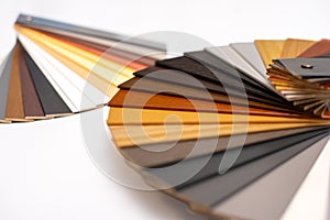 Samples of wooden blinds for windows in a store.