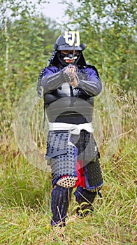 Samurai in armor with katana sword