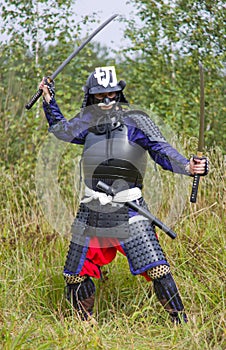 Samurai in armor with two swords