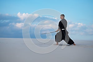 Samurai on the blue cloudy sky background