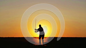 Samurai yakuza with a sword at sunset of the day. Sport, hobbies, interests.