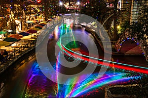 San Antonio Riverwalk at night Christmas time with some skyline.