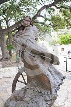 San Antonio, Texas, U.S - April 6, 2024 - The statue of Susanna Dickinson and her daughter Angelina outside the Alamo