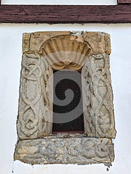 Window in the chapel of San Bartolome de Nava cemetery showing Viking type ornamentation, Nava, Asturias, Spain photo