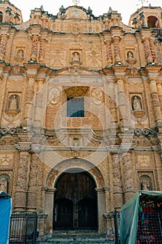 San Cristobal de las Casas, Chiapas, Mexico. Decorative facade of Santo Domingo surrounded by arts and crafts market photo