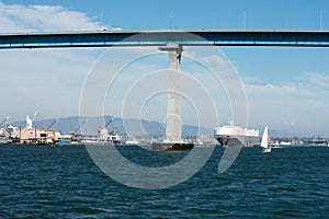 San Diego bay with sailboat and Coronado Bay Bridge