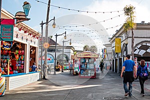 People Walk on Midway at Belmont Park in San Diego