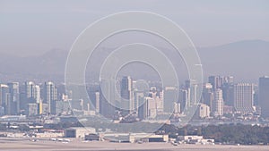 San Diego city skyline, cityscape of downtown, California Point Loma. Airplane.