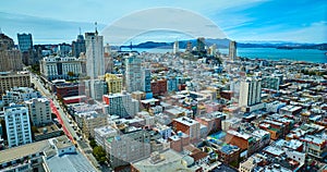 San Francisco aerial residential apartments with view of bay and distant Golden Gate Bridge, CA