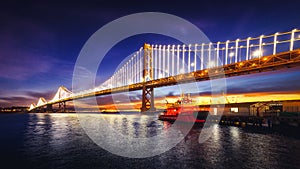 San Francisco Bay Bridge Illuminated at Sunrise