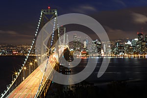 San Francisco Bay Bridge and skyline at night