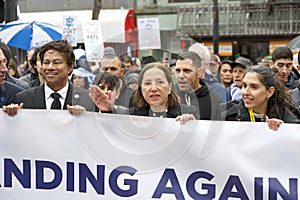 Politians and Unidentified participants in a March Against Anti-Semitism up Market Street to Civic Center. Marching in the rain