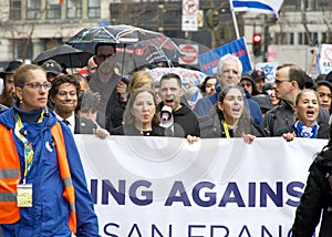 Politians and Unidentified participants in a March Against Anti-Semitism up Market Street to Civic Center