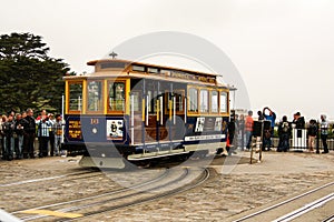San Francisco, California / United States of America - May 27th 2013: Historic yellow and blue cable car in Friedel Klussmann