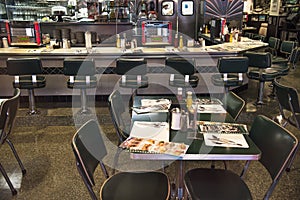 San Francisco, California, United States - circa 2016 - 1950s retro diner cafe with stools, counter juke box