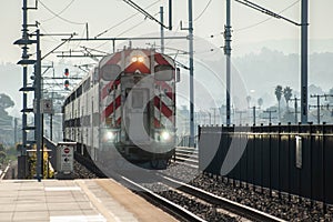 SAN FRANCISCO, CALIFORNIA, UNITED STATES - 30 October 2022: Catrain approaching San Bruno station photo