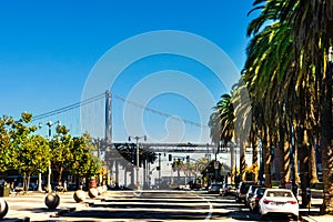 San Francisco city street. Street view from the Embarcadero plaza to the San Francisco Oakland Bay Bridge photo