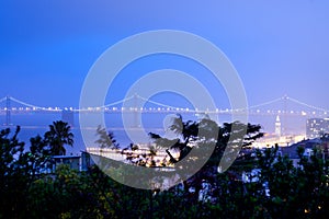 San francisco-oakland bay bridge and Port of San Francisco at night