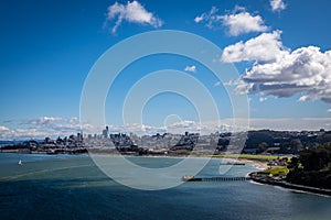 San francisco skyline including crissy field and some very while clouds on the upper left