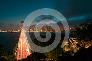 San Francisco Skyline by Night with traffic across the Bay Bridge