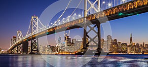 San Francisco skyline with Oakland Bay Bridge in twilight, Calif