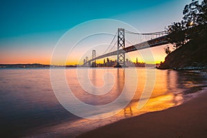 San Francisco skyline with Oakland Bay Bridge at twilight, California, USA