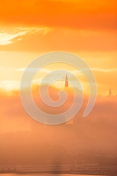 San Francisco skyline at sunrise between clouds