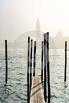 San Giorgio Maggiore church and wooden pier in Venice, Italy.