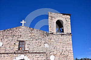 Mission church against blue sky Chihuahua state, Mexico photo
