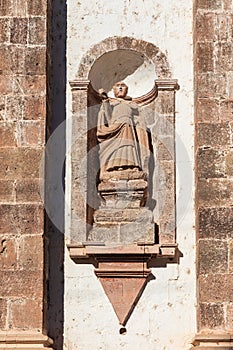 Sculpture of a priest on the San Ignacio Mission in Baja. photo