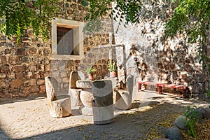 Table and chairs in a courtyard at the San Ignacio Mission photo