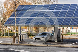 SAN ILDEFONSO, SEGOVIA, SPAIN - OCTOBER 24, 2018: Car charging station for self-sufficient and first photovoltaic panels in Europe