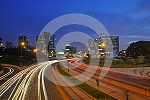 San Isidro aerial view of skyscraper and corporations at night with highway