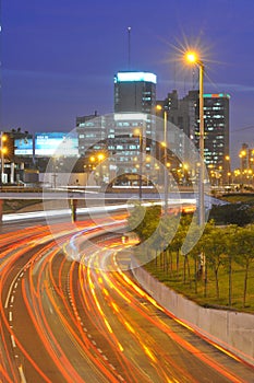 San Isidro aerial view of skyscraper and corporations at night with highway with traffic Peru