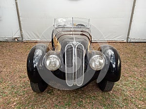 Old black sport 1930s BMW 328 roadster. Autoclasica 2022 classic car show.