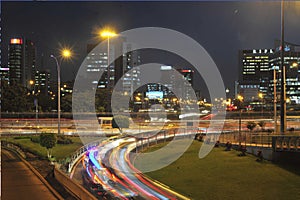 San Isidro city with skyscrapers and offices at night highway car congestion Peru