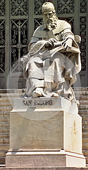 San Isidro statue in front of the Biblioteca nacional in Madrid - Spain photo