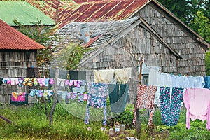 San Juan, Chiloe Island, Chile - Laundry Drying outside Wood Shingled House