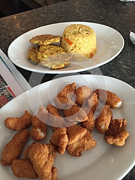 San Juan City,Puerto Rico Fish Nuggets in the house with tostones