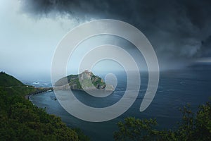 San juan de gaztelugatxe with stormy clouds