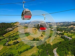 San Leo - Two cabins of the funicular over countryside