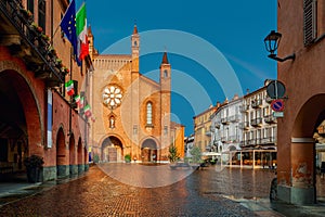 San Lorenzo cathedral on cobblestone town square in Alba, Northern Italy.