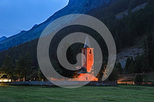 San Lurench church in Sils im Engadin village with illumination during blue hour