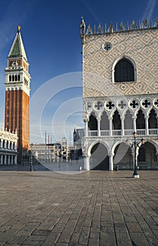 San Marco square with campanile and doge`s palace at sunrise in Venice, Italy