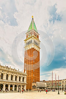 the San Marco square with the St Mark`s Campanile tower in Venice
