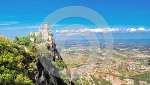 San Marino castle on a cliff during the day, sunny