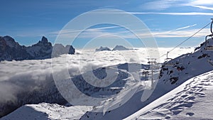 San Martino di Castrozza, on top of Dolomites Mountains, skiing over the clouds