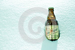 San Miguel beer bottle in snow