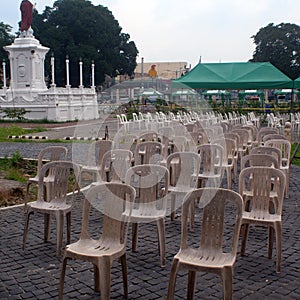 Many resin plastic chairs arranged in rows are prepared for the people to be inoculated with covid 19 vaccines at the cathedral pa